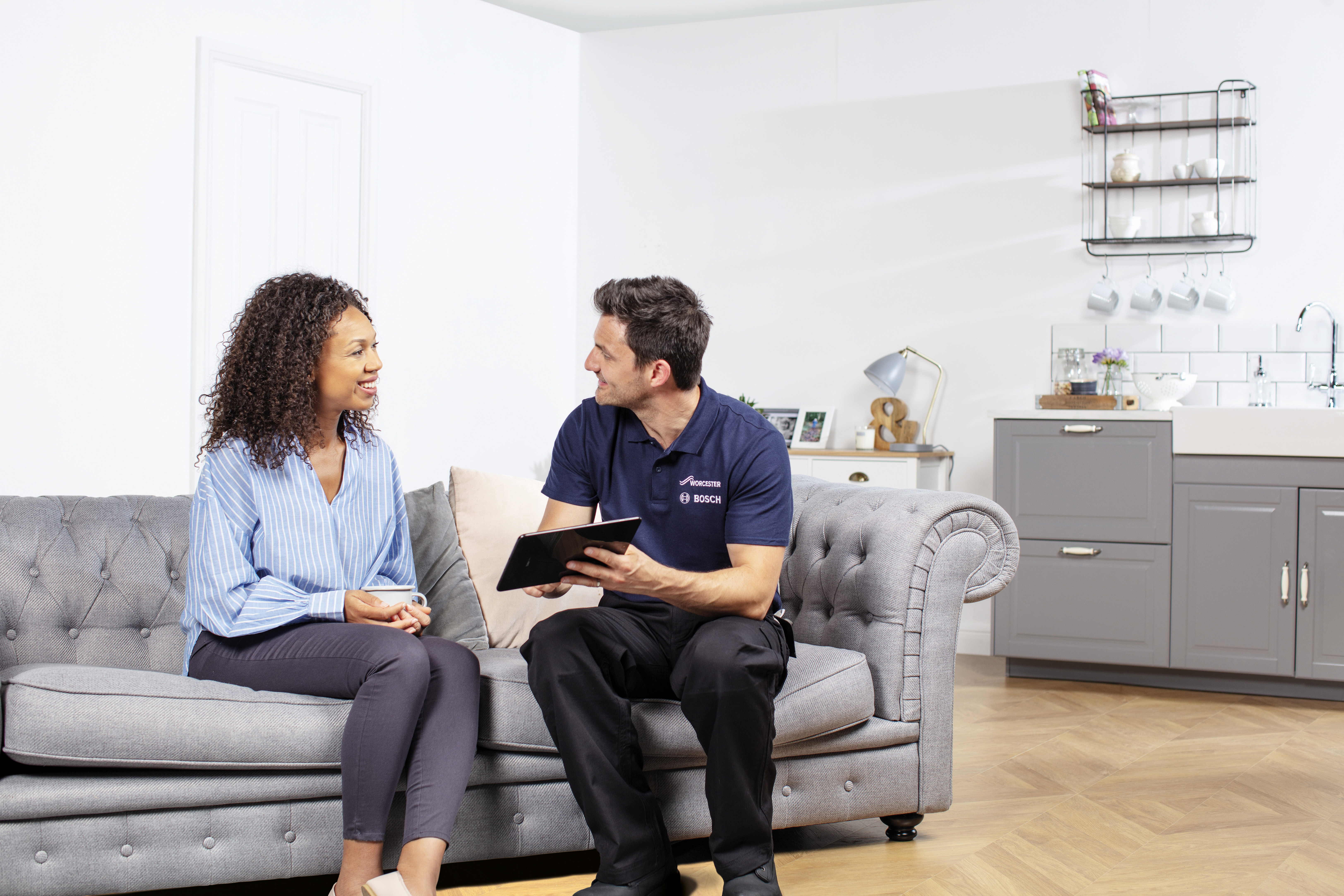 Engineer explaining boiler Guarantee to customer